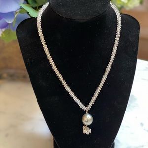 Cultured black Tahitian pearl and crystal necklace.